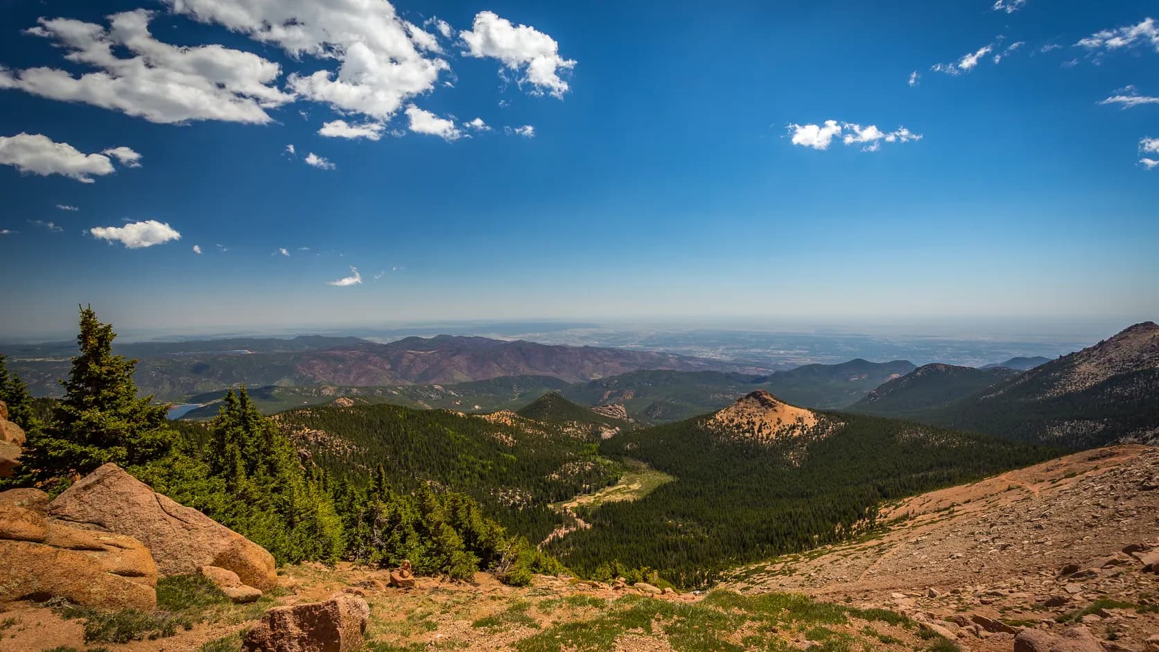 Colorado mountain ridges and forest with a wide view toward the plains